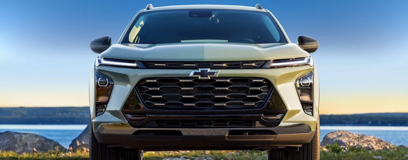 A green 2024 Chevy Trax is shown from the front after leaving a Chevy dealer near me.