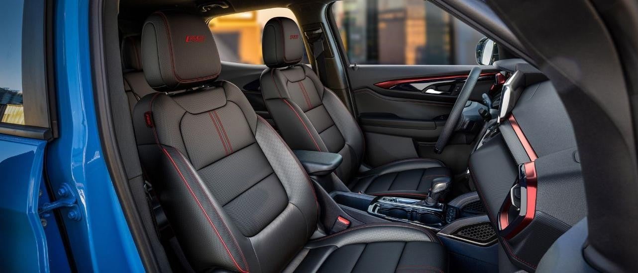  The front black leather seats are shown in a 2024 Chevy Trailblazer for sale.