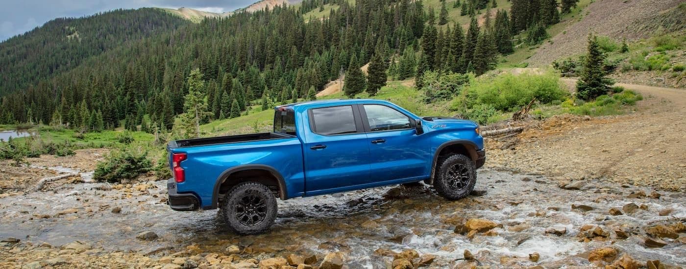 A blue 2024 Chevy Silverado 1500 ZR2 off-roading.