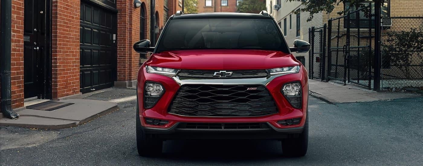 A red 2022 Chevy Trailblazer RS is shown from the front parked on a city street.